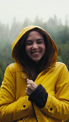 woman in a yellow raincoat in the rain