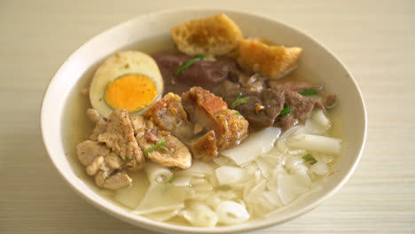 paste of rice flour or boiled chinese pasta square with pork in clear soup