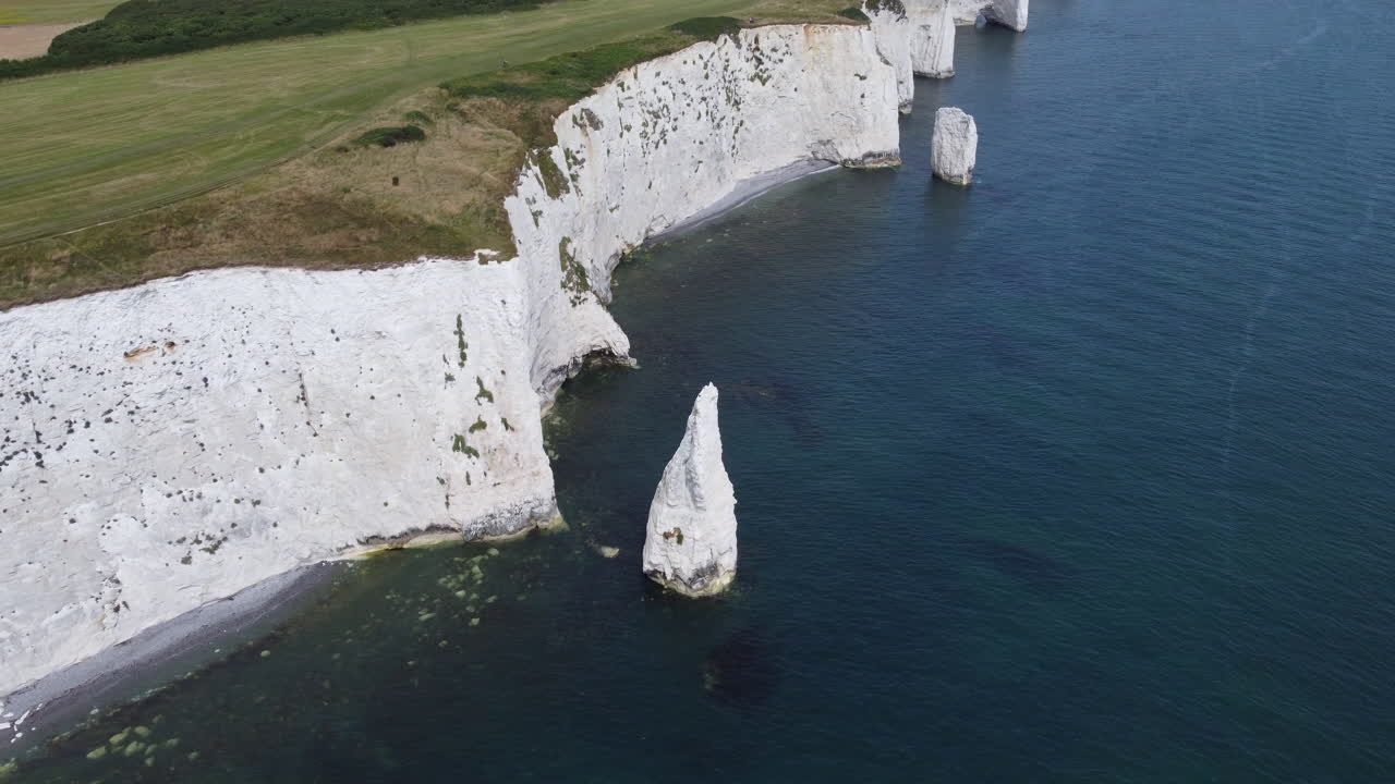 Isolated Sea Stack Reveal of Old Harry Rocks UK Jurassic Coast Aerial