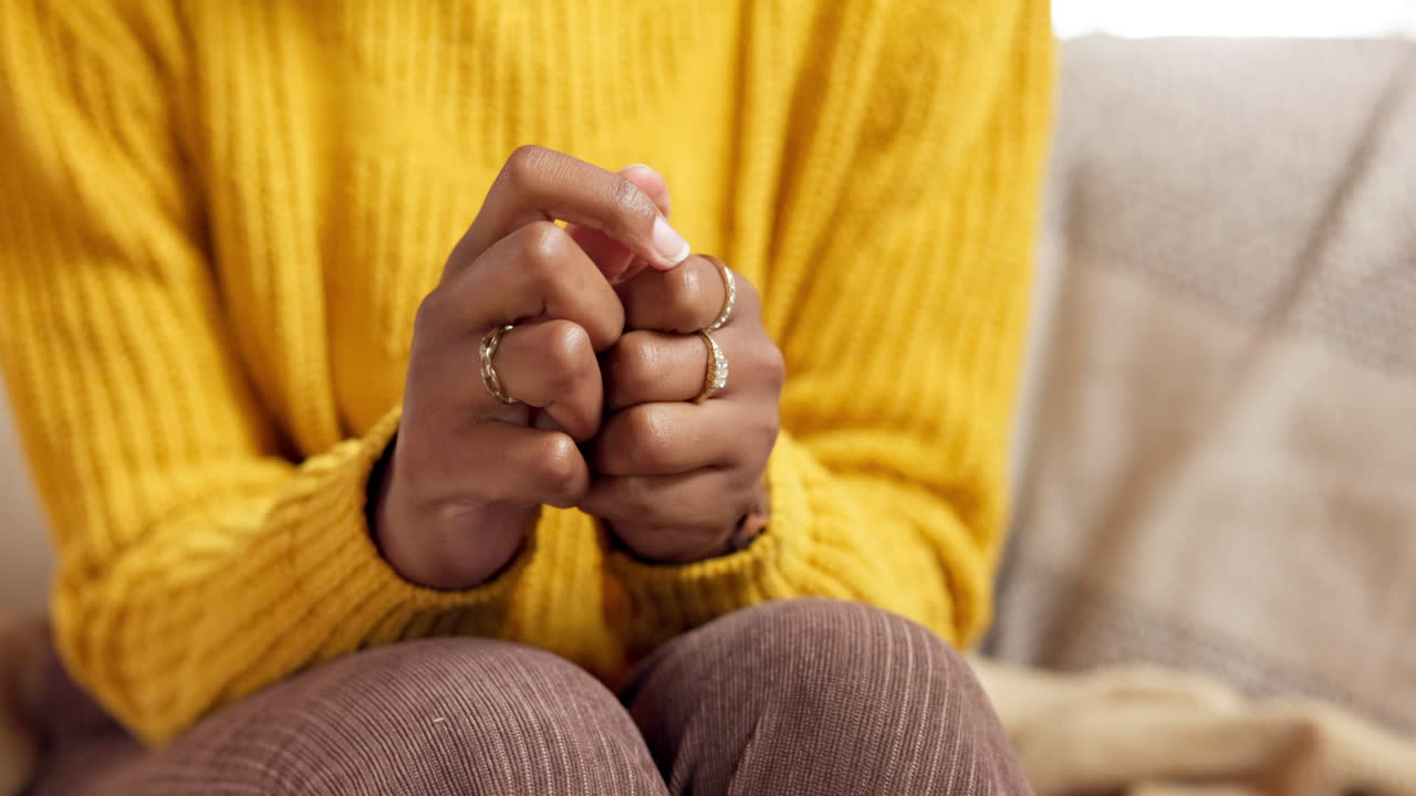 Close-up of a person's hands wearing rings