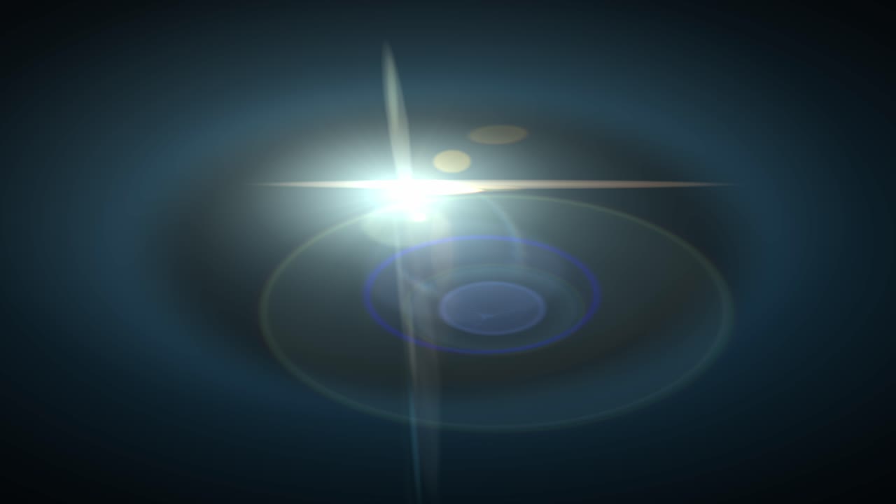 Stylized optical lens flare with rings and starburst moving from left to right. Isolated on black background, perfect for compositing, motion graphics, and vfx overlays