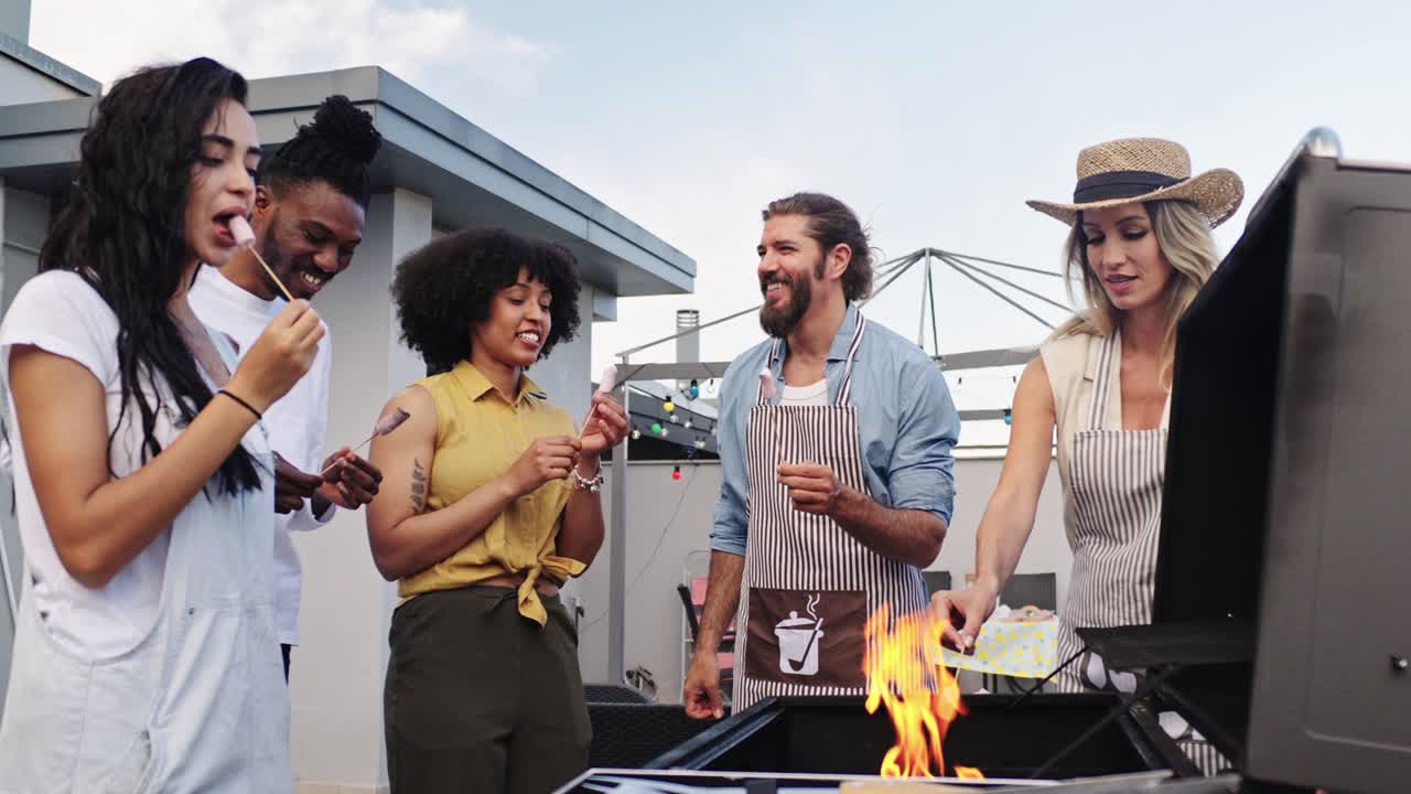 Friends Grilling Marshmallows on a Rooftop Barbecue