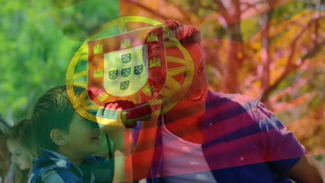 animation of flag of portugal over caucasian family in park