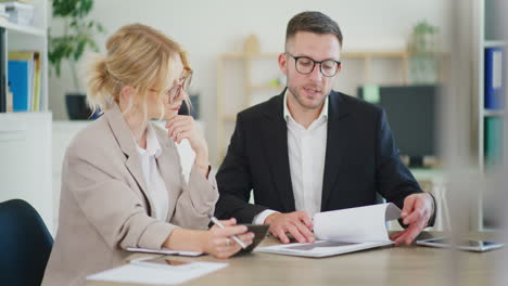 business colleagues discuss project in office