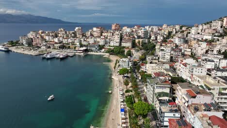 coastal cityscape with view of the ionian sea in saranda, albania. wide aerial shot
