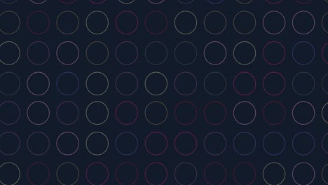 animación digital de múltiples formas circulares coloridas contra un fondo negro