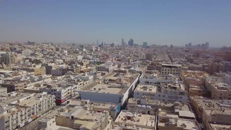 horizontal pan of khobar city during the day time with the khobar skyline in the back and the khobar corniche along with the corniche water tower visible