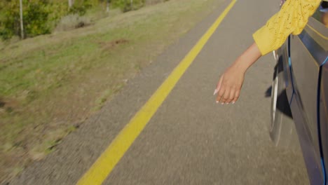 Young-woman-on-a-road-trip-in-their-pick-up-truck