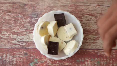 preparing white chocolate with dark chocolate pieces