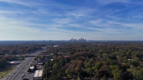 busy traffic on a highway in charlotte north carolina usa city skyscrapers far away on the horizon busy traffic on a highway in charlotte north carolina usa city skyscrapers far away on the horizon drone shot