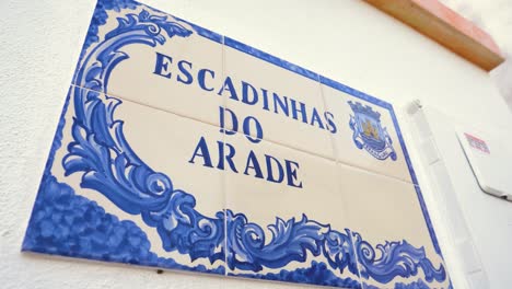 arade stairs street tile board in ferragudo, algarve, close up