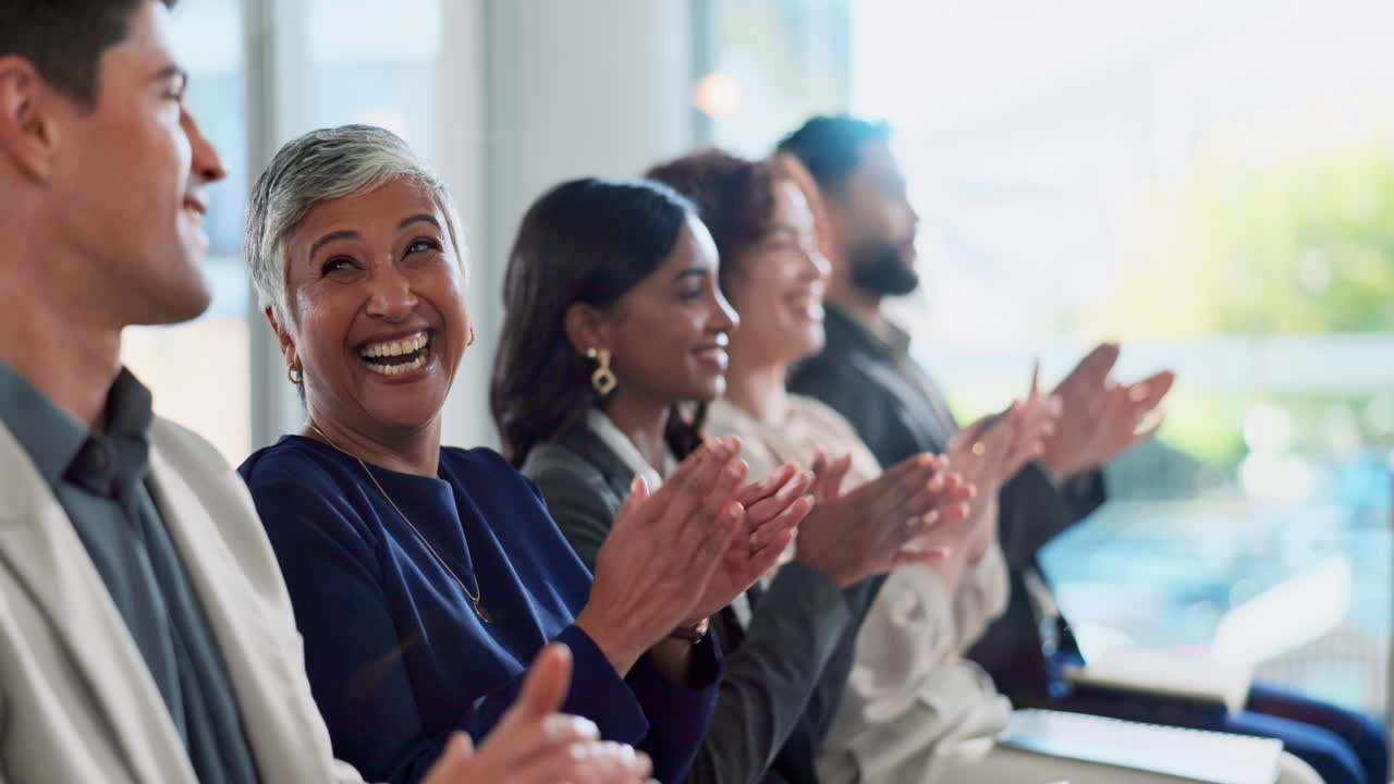 Group of people applauding at a business event