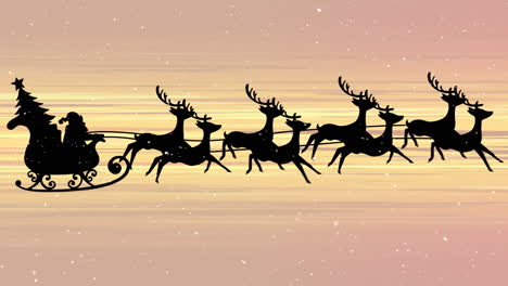 snow falling on santa claus in sleigh being pulled by reindeers against yellow light trails