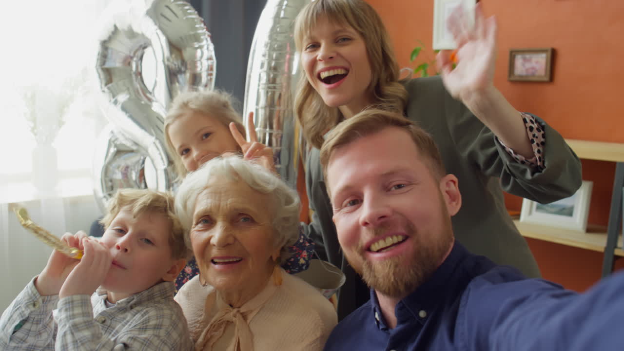 POV of Happy Family Taking Selfie on Grandma Birthday Dinner