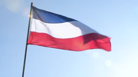 upside down dutch flag waving as farmers protest