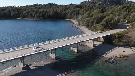 scenic lake bridge with car