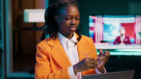 african american student working on her bachelor paper essay at home