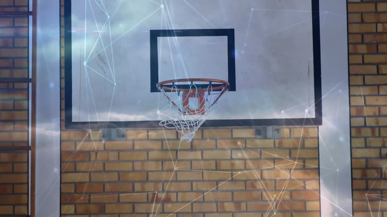 Basketball entering from right, arcing over rim, passing through net to score as overlays shimmer