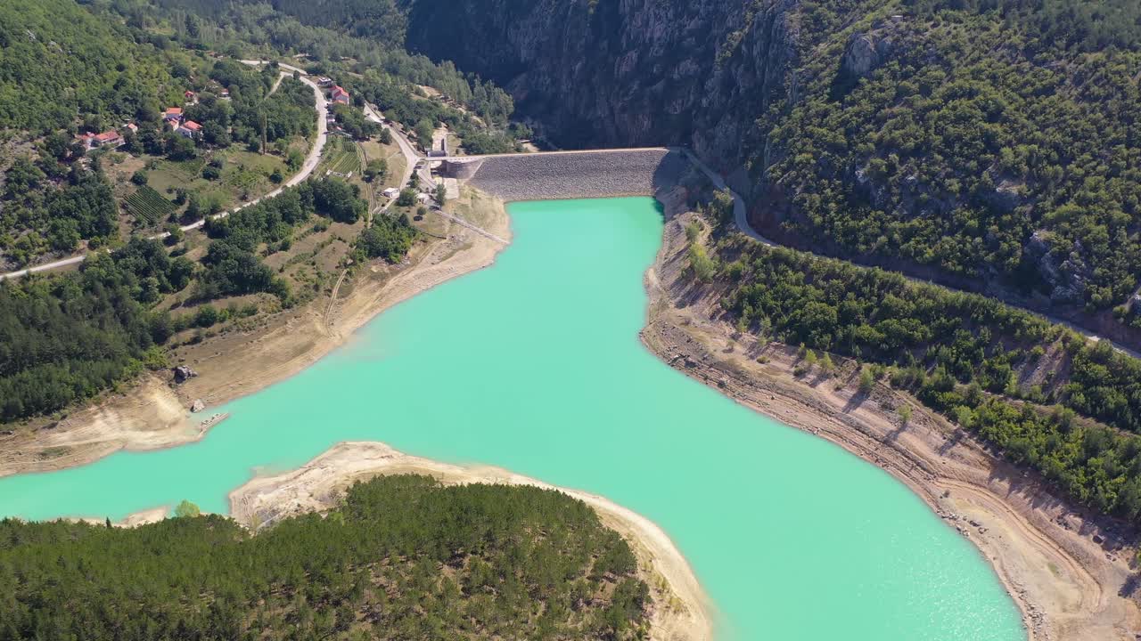 Zeleno jezero reservoir Dam wall in Croatia near the border with Bosnia on the Suvaja River, Aerial Pedestal Up Shot