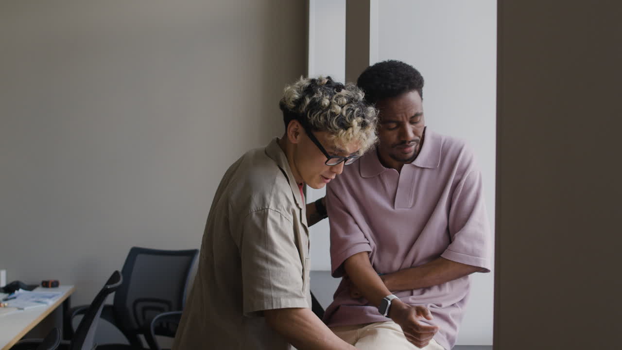 Colleague Offers Support to Upset Man in Office