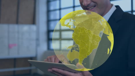 animation of yellow global network over happy businessman using tablet