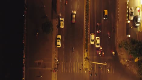 an aerial view with cinematic drone movement of the iconic marine drive nightlife with air india and trident hotel buildings in sight