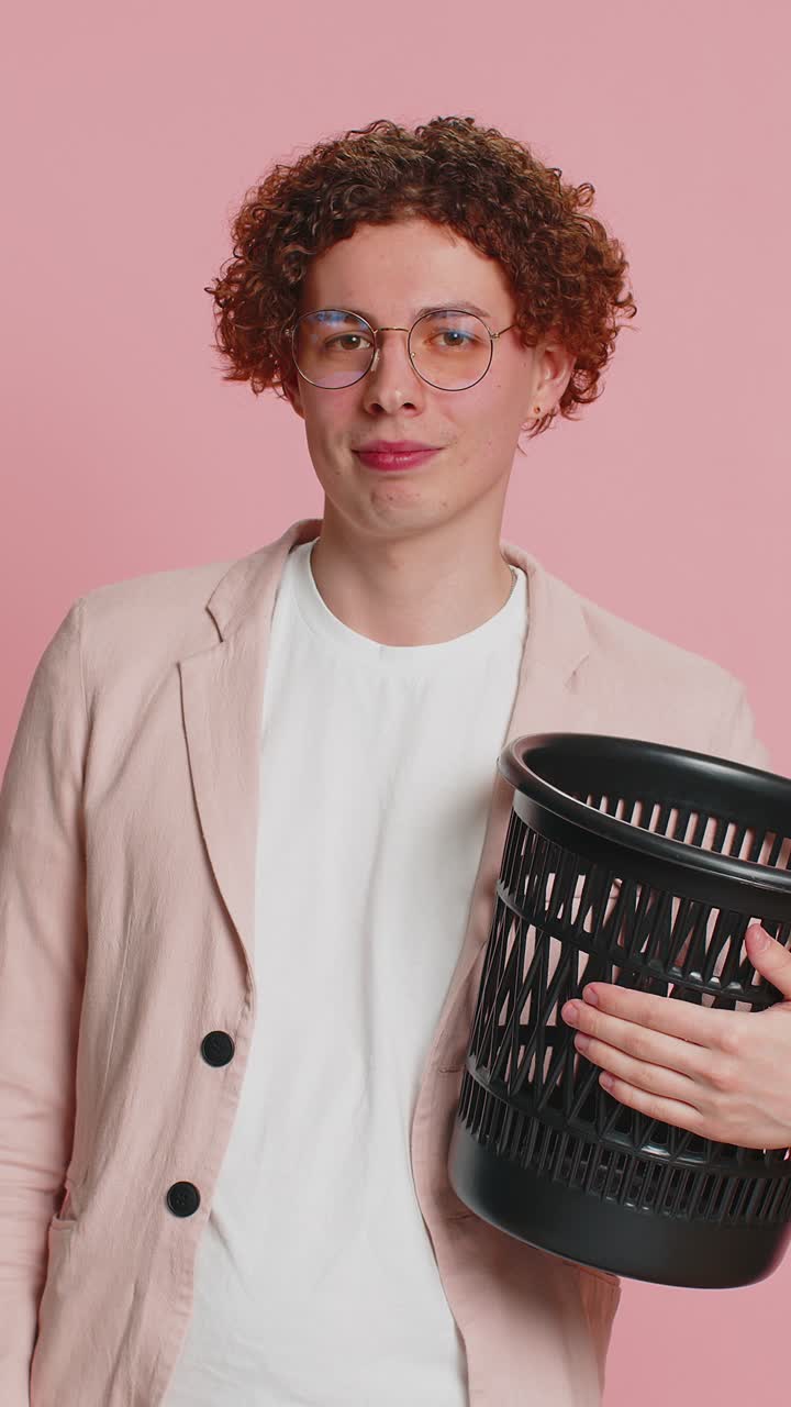 Man taking off throwing out glasses into bin after medical vision laser treatment therapy surgery