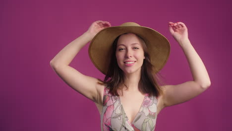 smiling woman in a floral dress and hat
