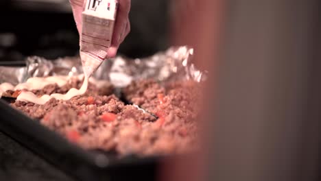 preparing a creamy meat dish