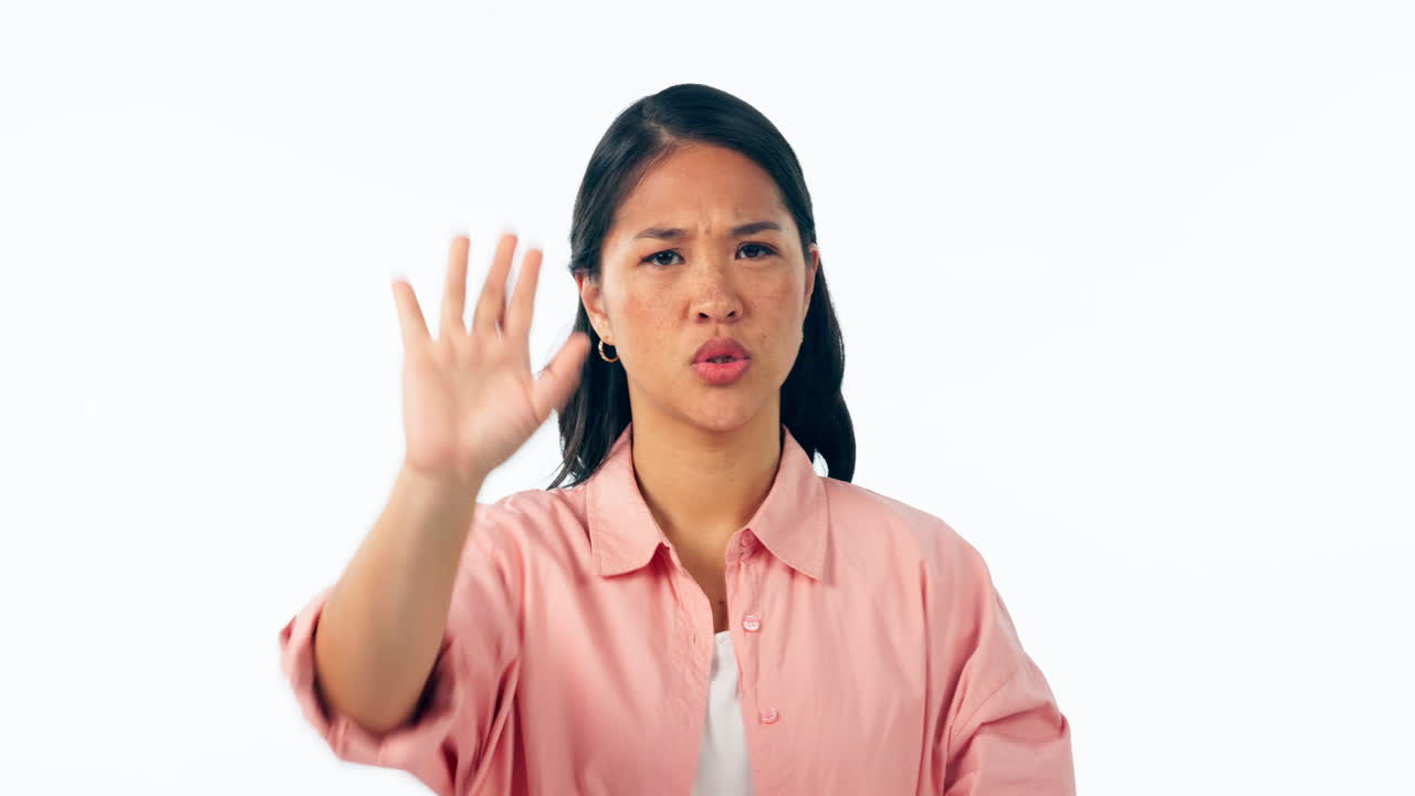 Stop, hand and face of woman in studio with dont