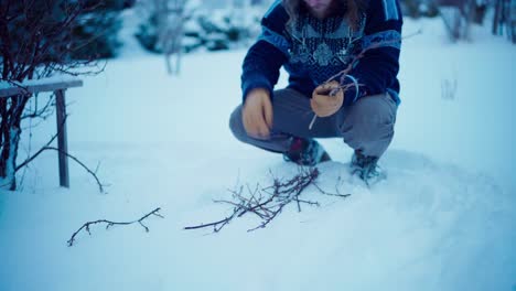 The-Man-is-Gathering-Kindling-Necessary-for-Igniting-the-Flame-Beneath-the-DIY-Hot-Tub---Static-Shot