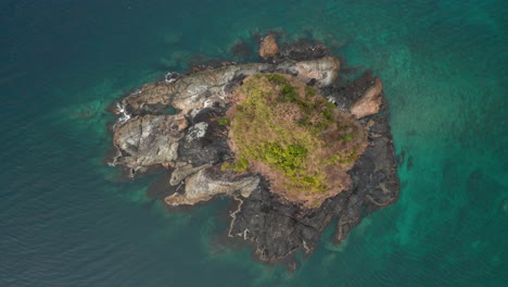 aerial top down showing bolog island in front of nacpan beach nearby el nido, palawan, philippines