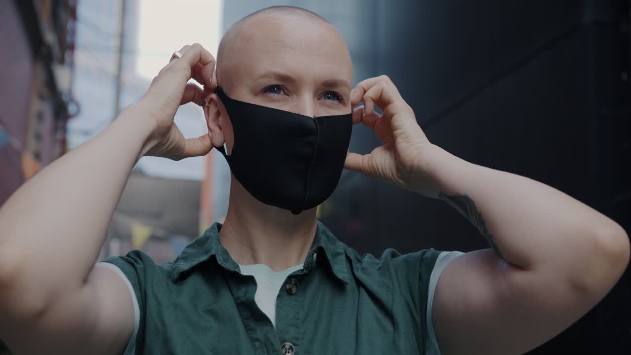 Woman wearing a mask in a city street