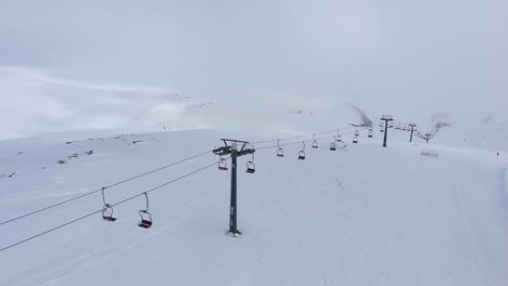 drone view over empty of people ski lifts resort snow covered slopes mountain kaimaktsalan greece