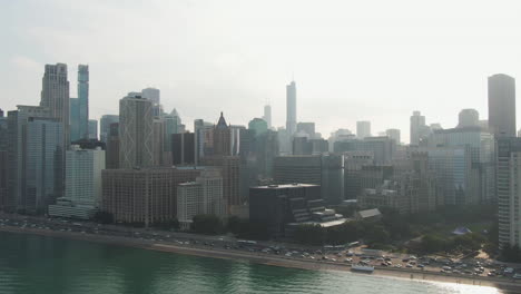 Wide-angle-aerial-view-of-downtown-Chicago-with-lots-of-cars-on-the-street-on-a-clear,-summer-afternoon