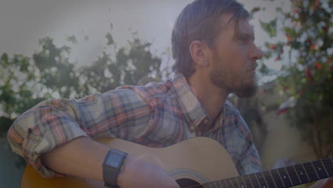mid adult guitarist sitting backyard showing floating notes and smartwatch data for music education