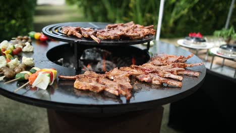 ribs and vegetables cooking on a barbecue grill