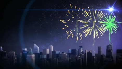 Fireworks-exploding-and-spot-of-light-over-cityscape-against-blue-background