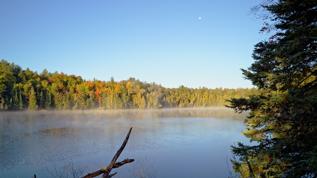 Cinematic calm river shot with fog at dawn