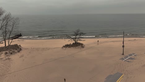 Slow-push-toward-a-sand-covered-street-during-a-storm