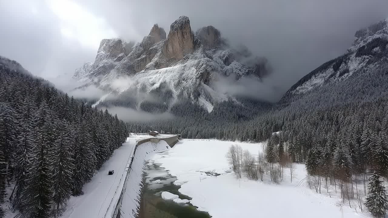 Majestic Winter Landscape Featuring Snow-Covered Mountains and Serene Snowy Valley Captured in Stunning Aerial Views with Cloudy Skies
