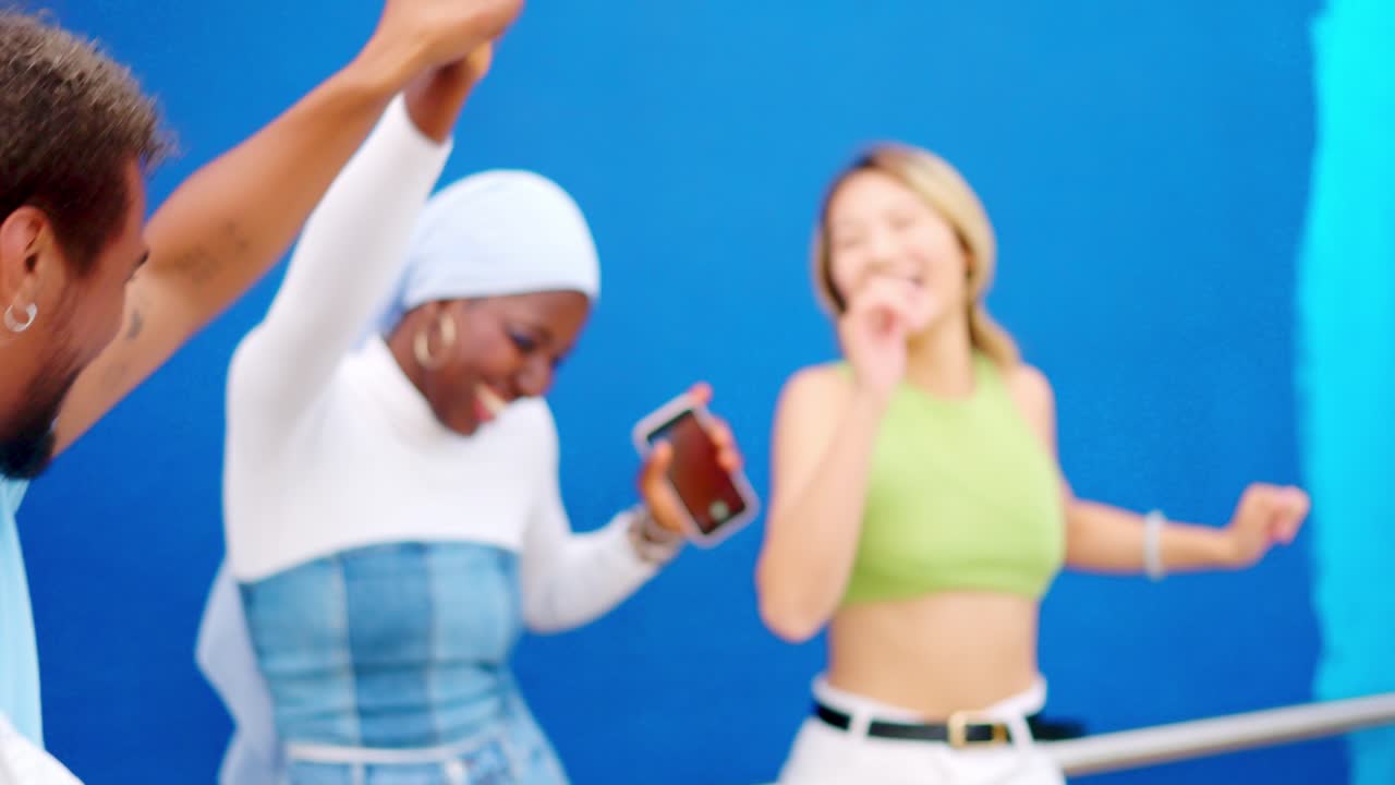 Latin man asking to dance to an african friends outdoors