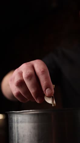 chef preparing mushrooms in a pot