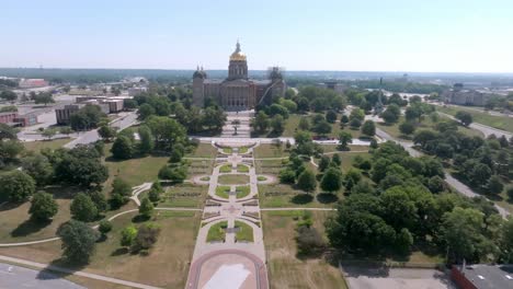 iowa state capitol building in des moines, iowa with drone video moving in wide shot