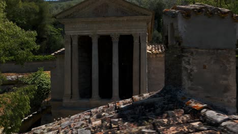 Aerial-View-Of-Temple-of-Clitumnus,-Flying-Over-Roof-Tiles-And-Chimney