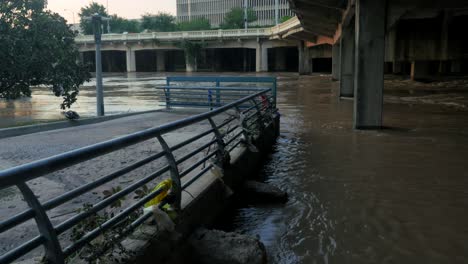 water rushing up under bridge in houston after hurricane harvey