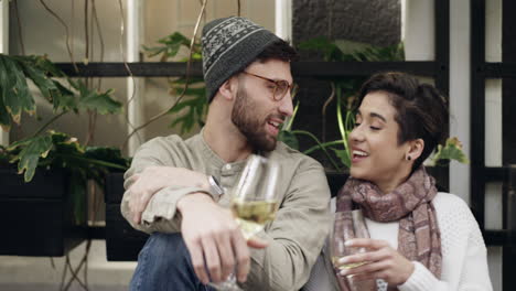 couple enjoying wine at outdoor cafe