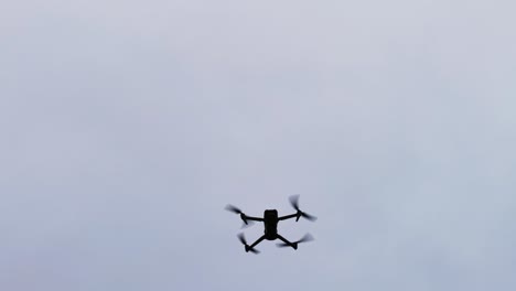 unmanned aircraft descend during flight on cloudy sky background, czechia
