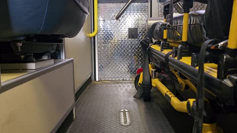 Rear-doors-of-ambulance-opened-with-truck-airbags-lowering-to-unload-position-viewed-from-inside-ambulance