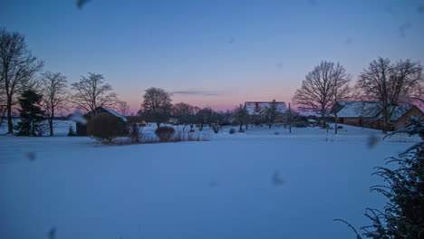 colorful dawn over small rural village landscape in winter season, fusion time lapse